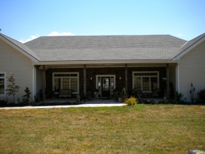 Nice brick front finish with patio entrance way.