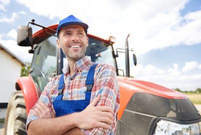 Farmer looking at his big farm